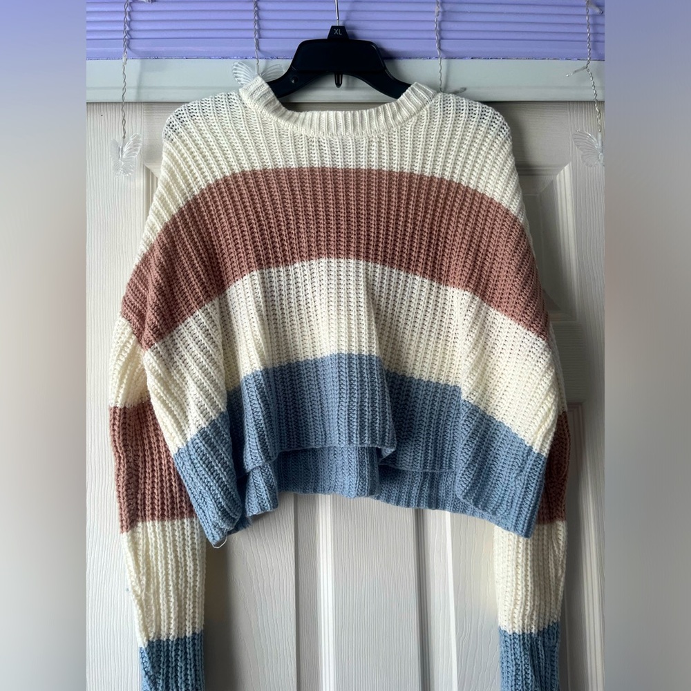 White, blue, and pink striped sweater. Knit-like and slightly cropped.